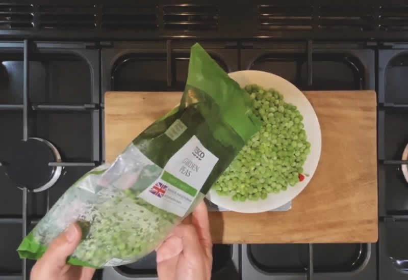 Carefully weigh out the correct amount of frozen peas for your dog